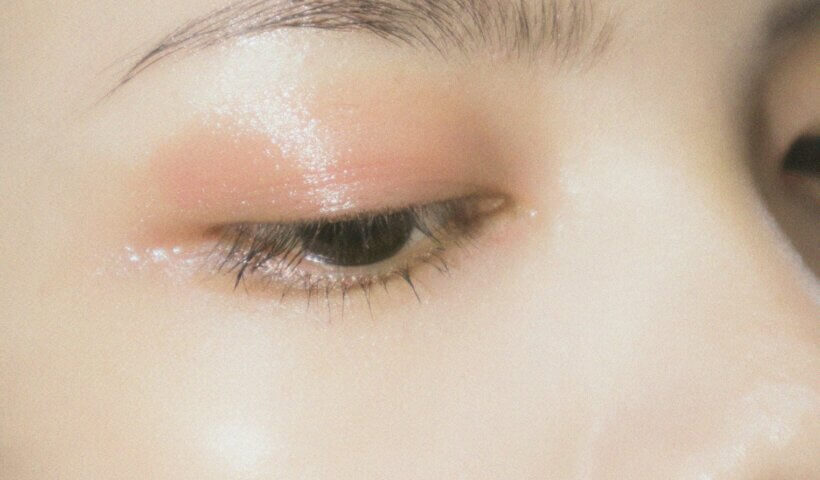 a close up of a woman's eye with makeup