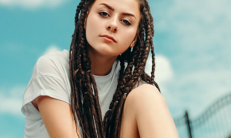 selective focus photography of woman with braided hair